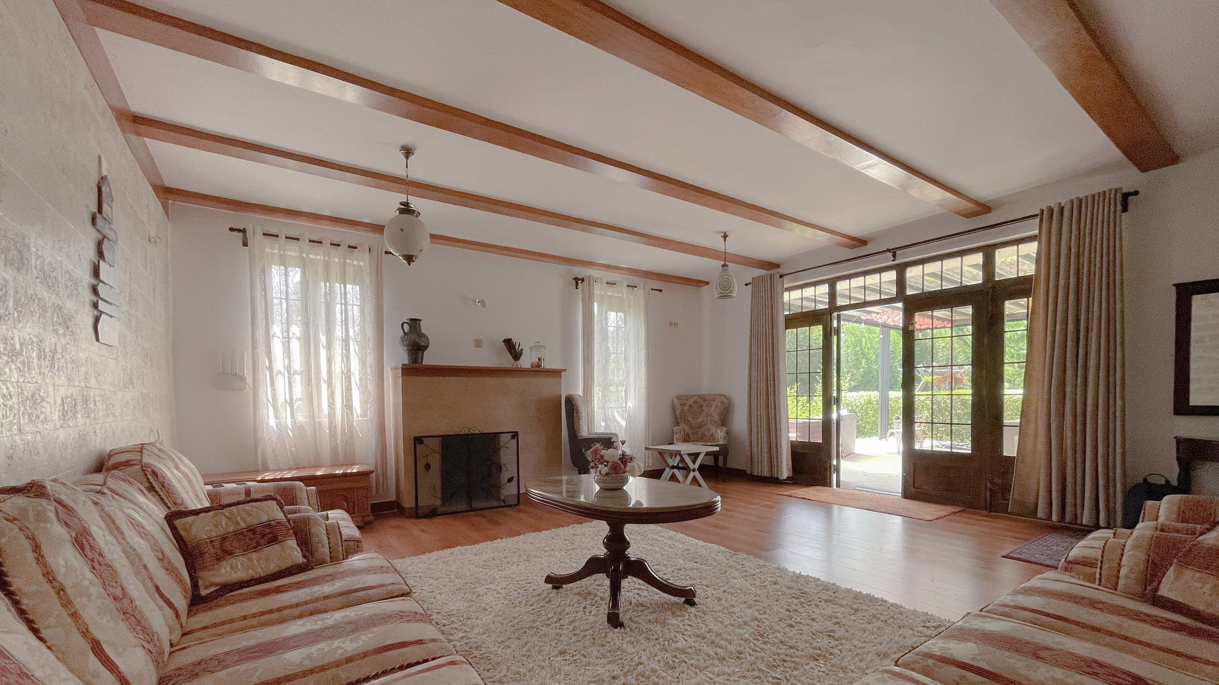 The main living room at Nanyuki Holiday Home, opening onto the garden